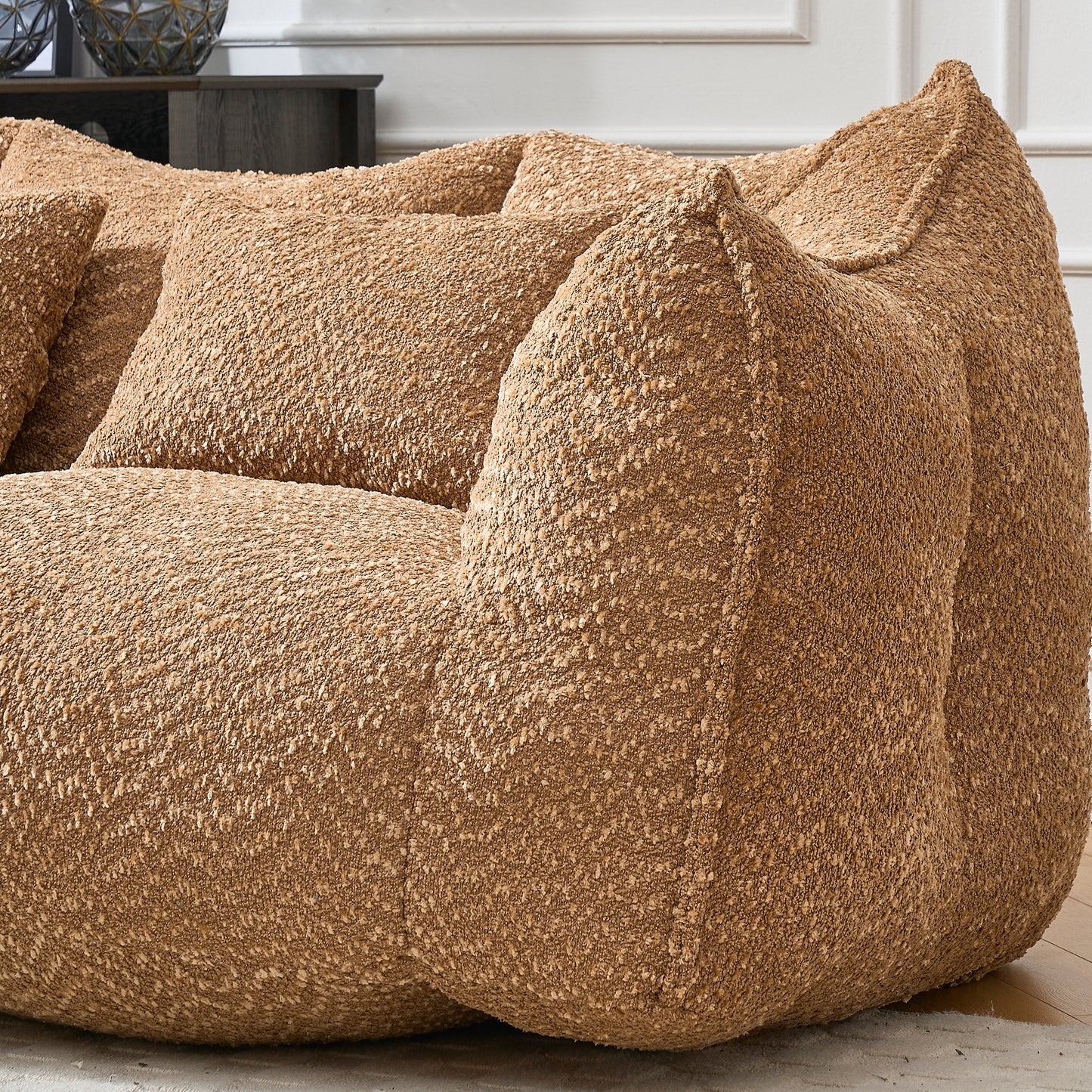 Textured taupe fabric beanbag chair with plush cushions for ultimate comfort