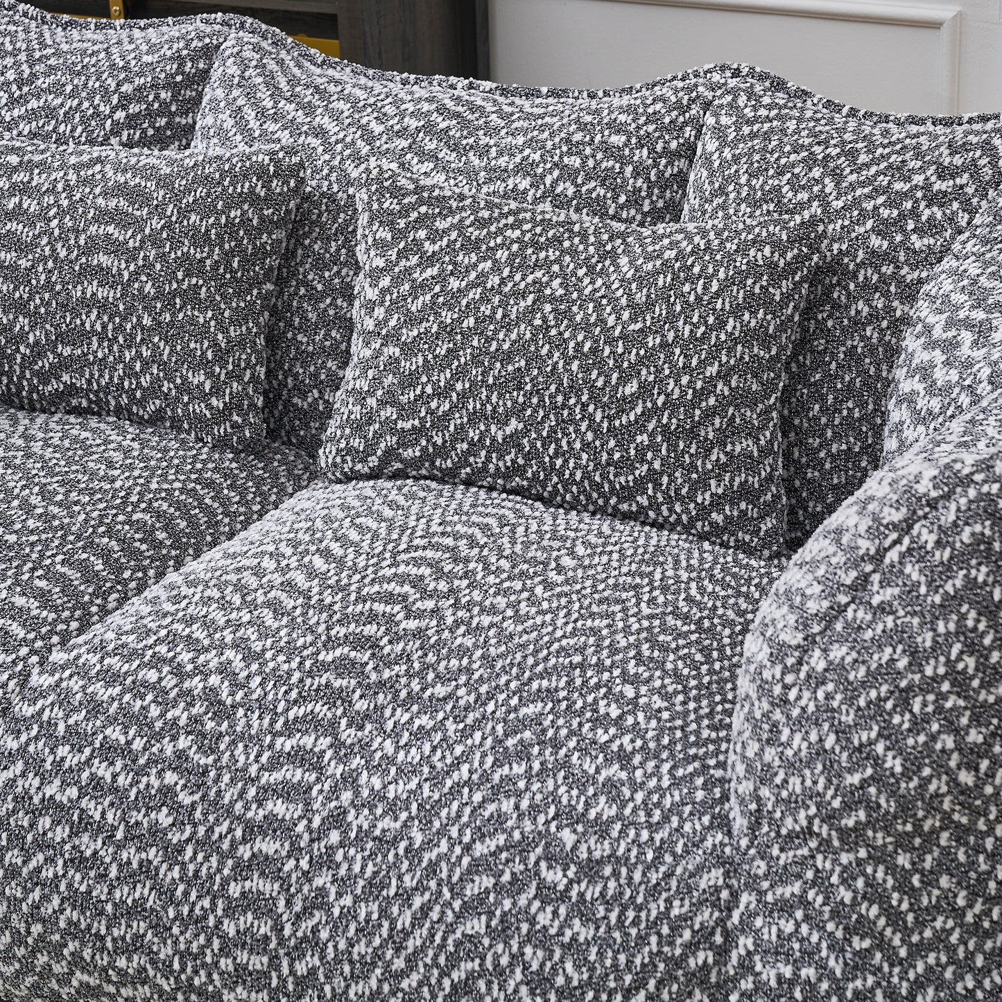 Cozy textured sofa with black and white chenille upholstery perfect for modern living rooms