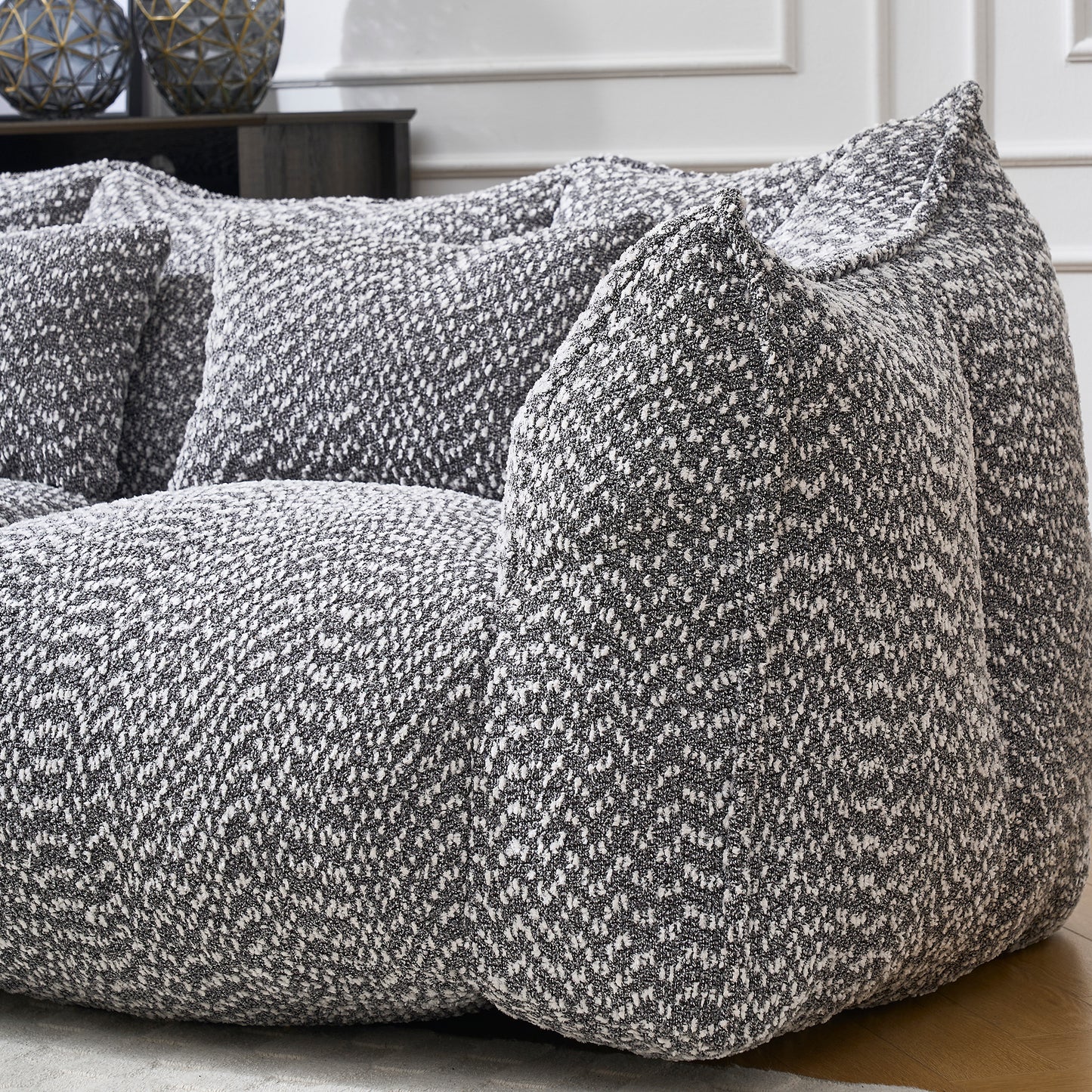 Textured grey and white boucle fabric sofa with plush oversized cushions
