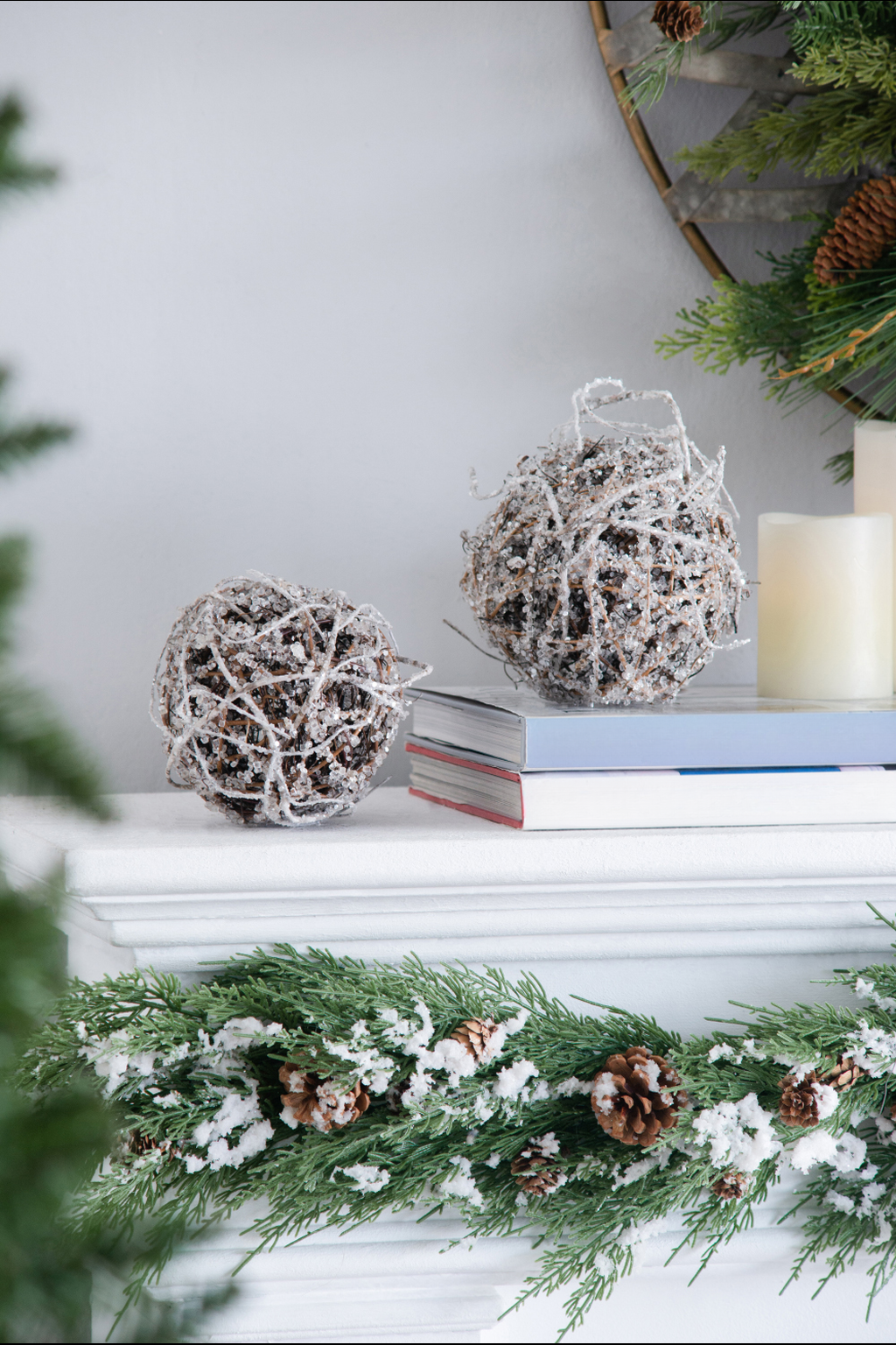 Frosted grapevine sphere with wood branches and scattered beads a rustic Christmas accent