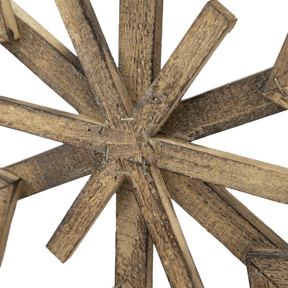 Distressed wood starburst wall decor with rustic charm and natural grain