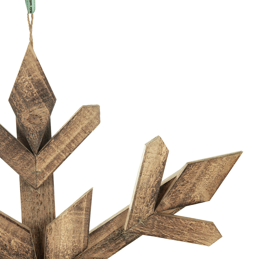 Rustic wooden snowflake ornament with weathered texture for holiday decor