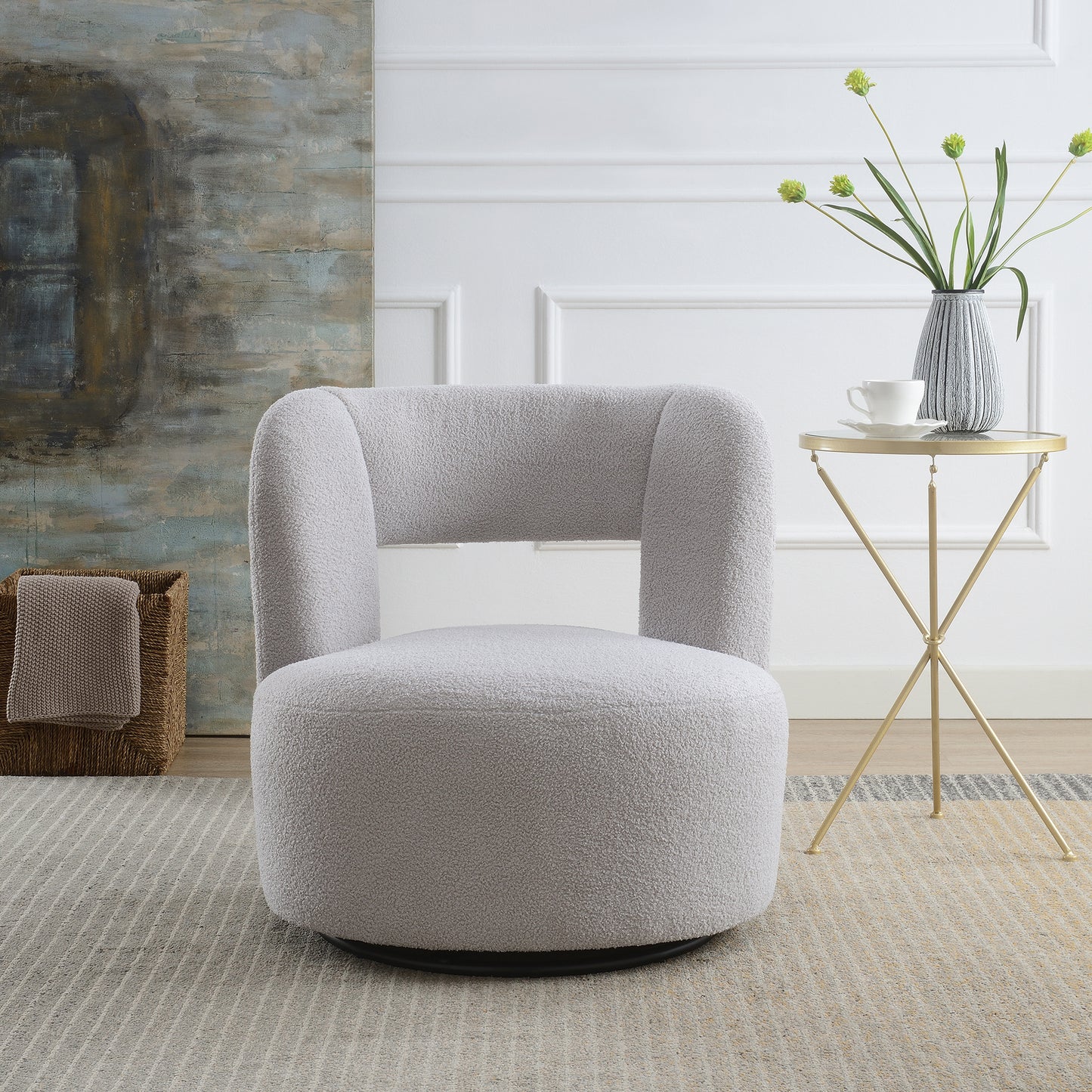 Light grey boucl swivel chair with curved back and plush seat
