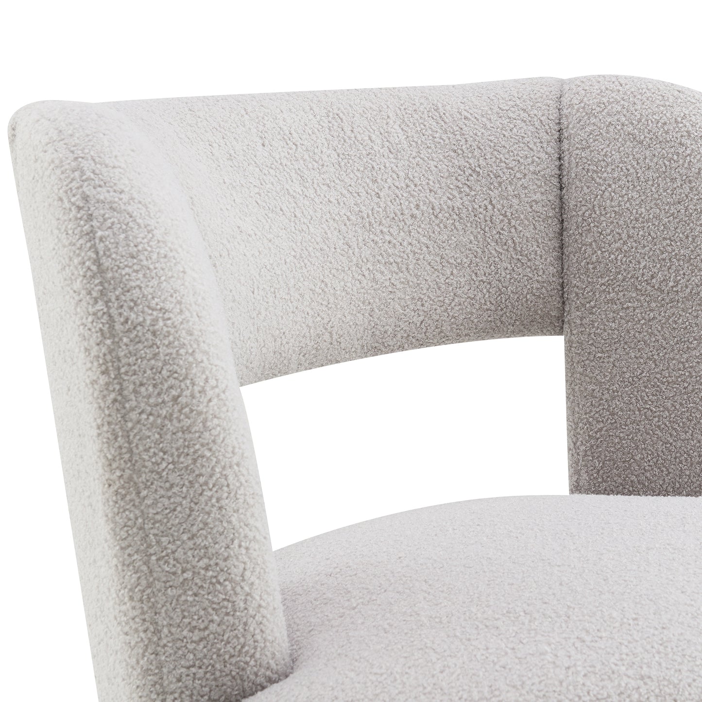 Closeup of a textured creamcolored boucle fabric armchair back