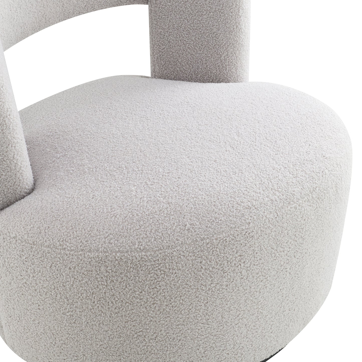 Plush light grey boucle armchair with curved back and rounded seat for ultimate comfort