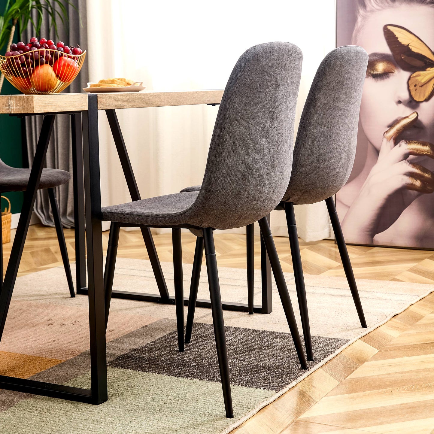 Grey upholstered dining chair with black metal legs modern design