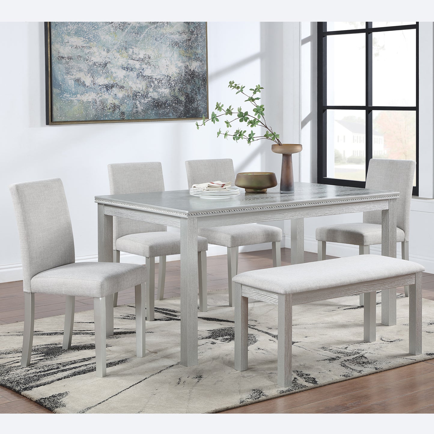Gray linen upholstered dining chairs with light wood finish legs