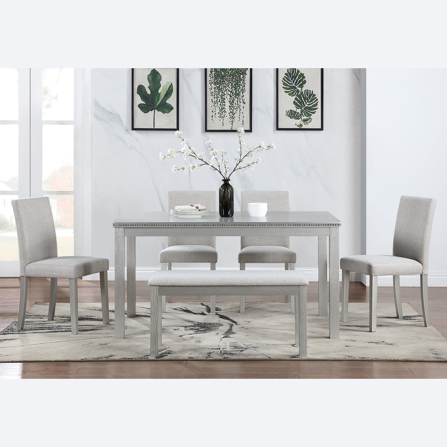 Light gray upholstered dining chairs with wooden legs