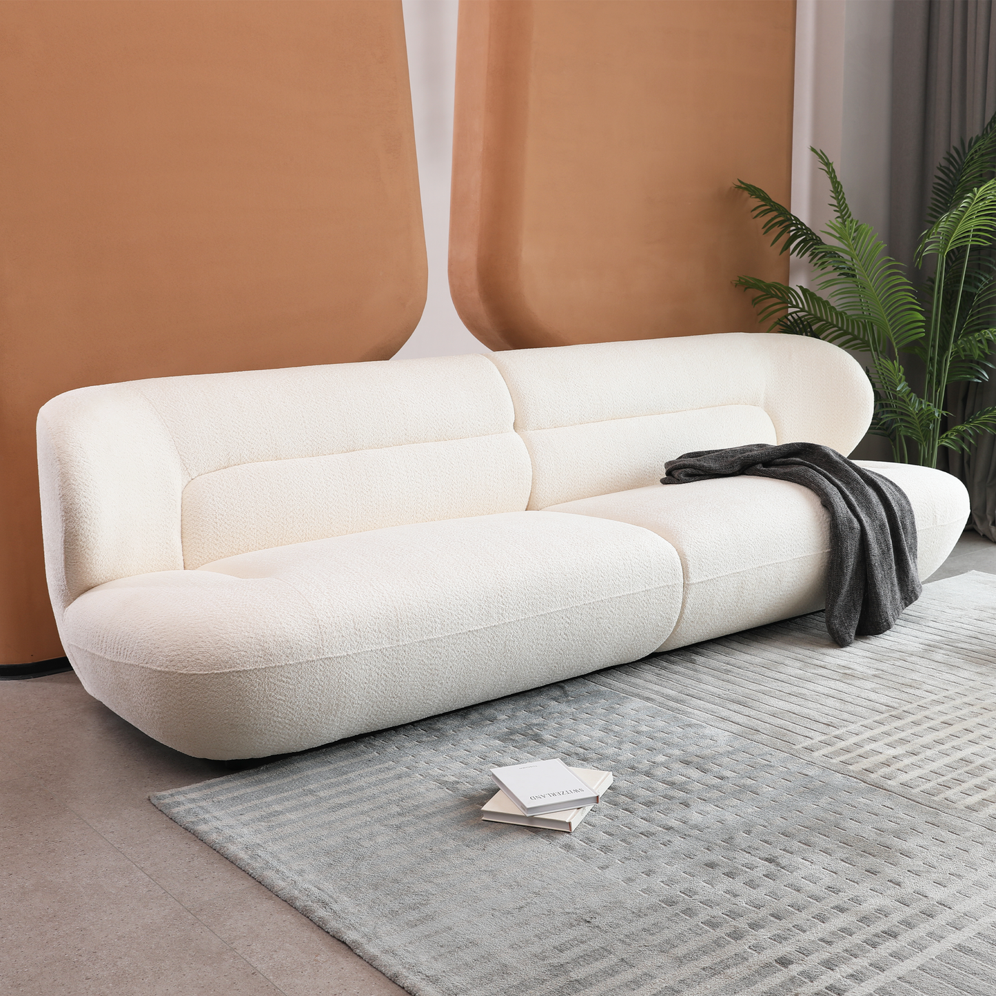 Luxurious cream boucle fabric sofa with a curved design and modern appeal