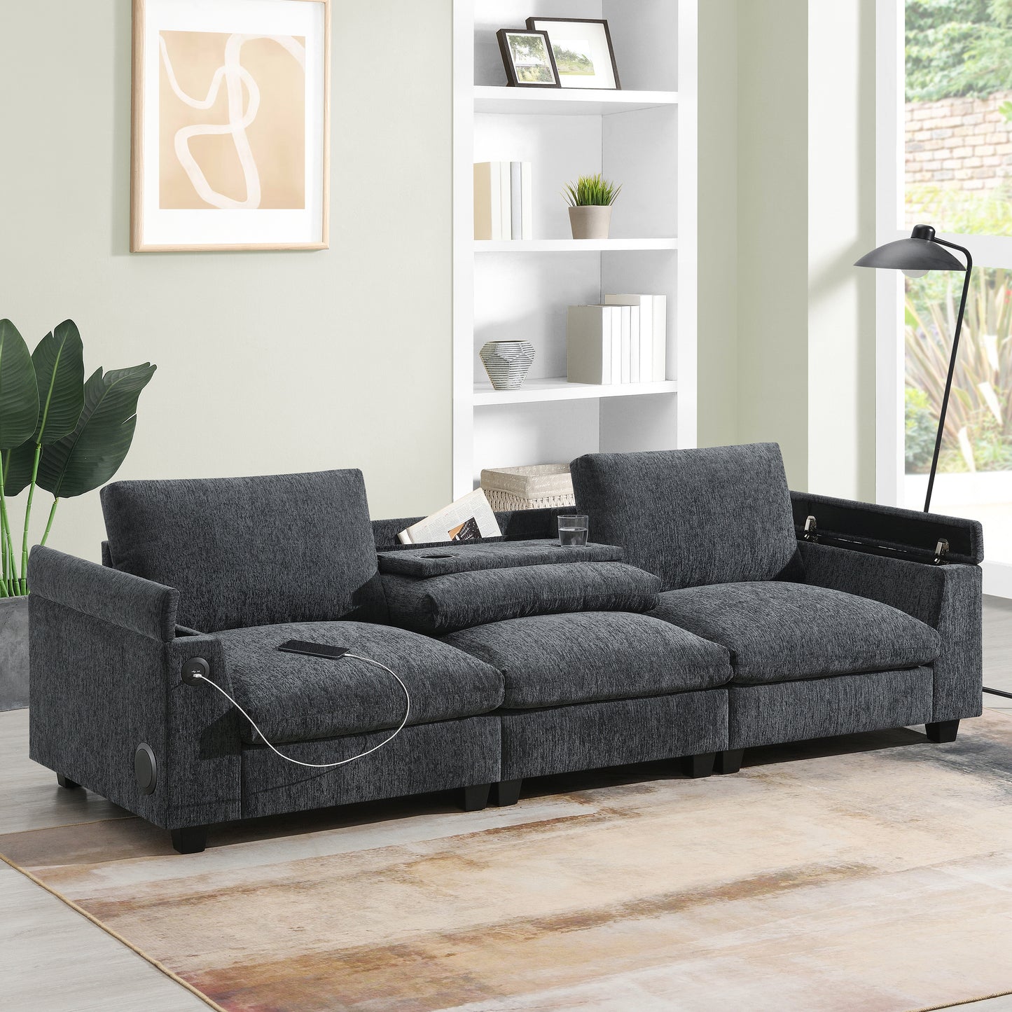 Dark grey fabric sectional sofa with builtin USB charging ports and a hidden storage compartment