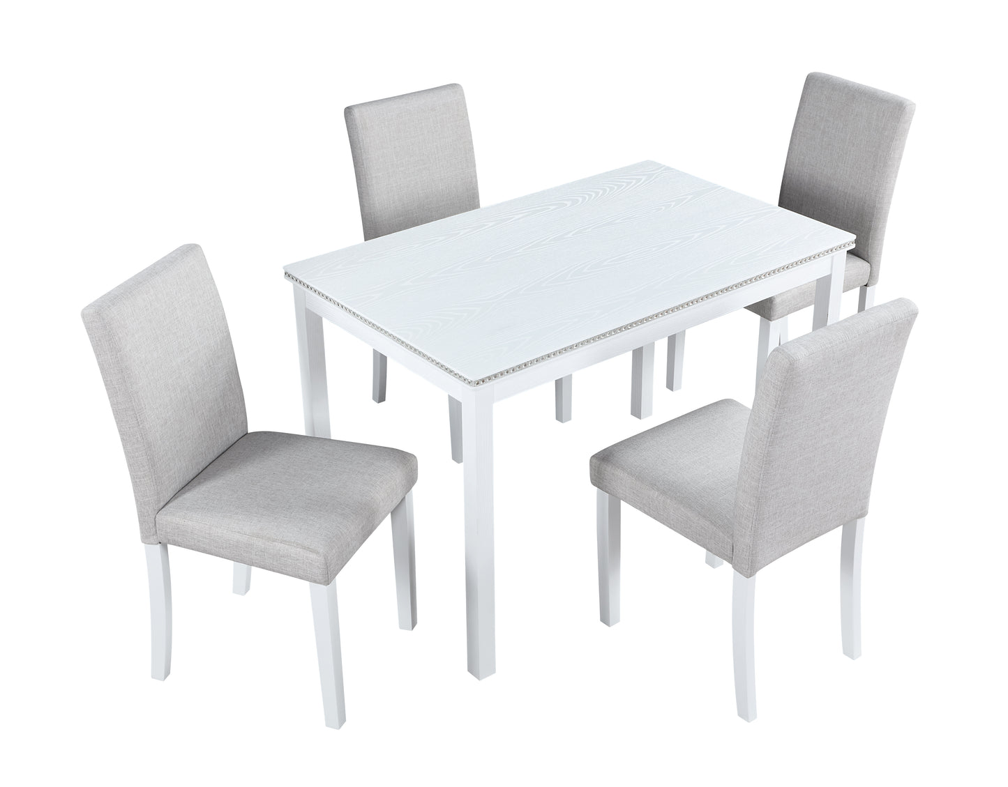 White wood grain dining table with nailhead trim and four grey upholstered chairs