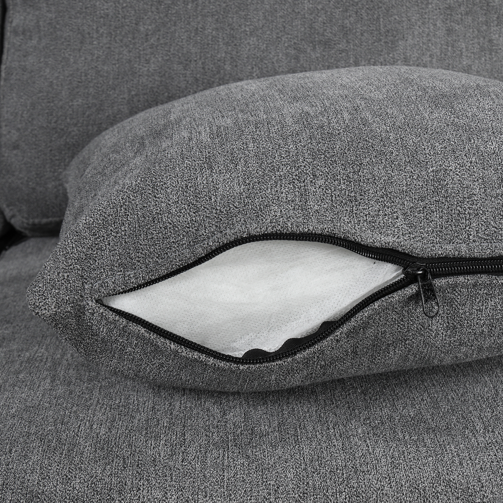 Closeup of a grey fabric cushion with an open zipper revealing white inner filling