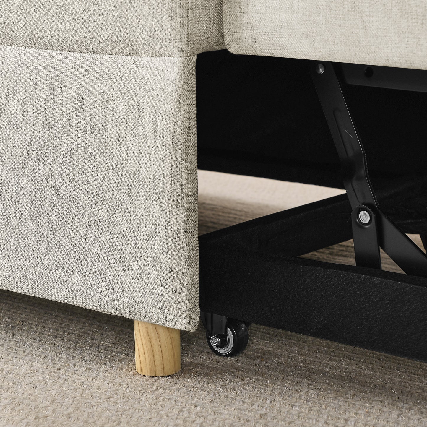 Beige linen sofa armrest with wooden leg and hidden black metal pullout mechanism