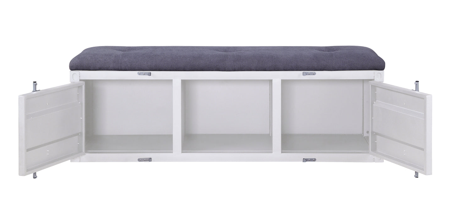 White storage bench with dark gray tufted cushion and three open compartments
