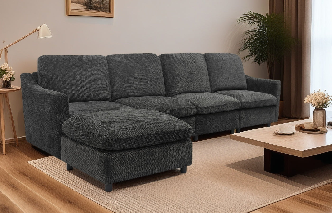 Dark grey fabric sectional sofa with chaise lounge and plush cushions