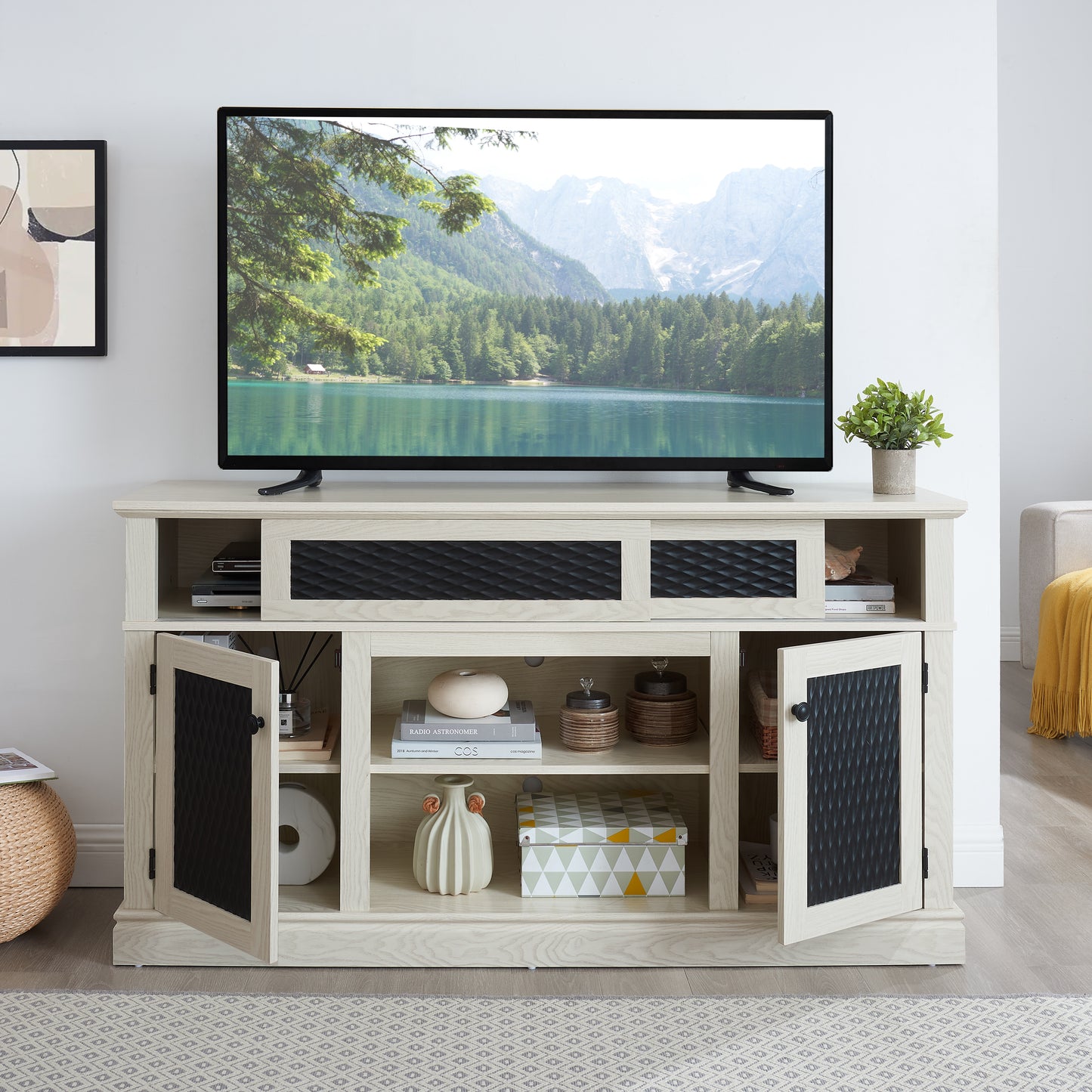 Light oak media console with black textured door inserts and open shelving