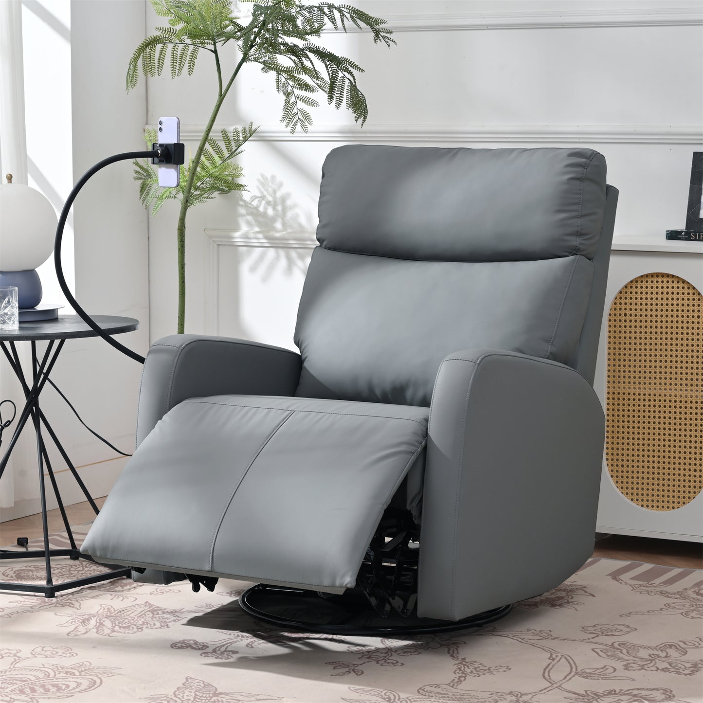 Gray faux leather recliner chair with adjustable footrest and swivel base