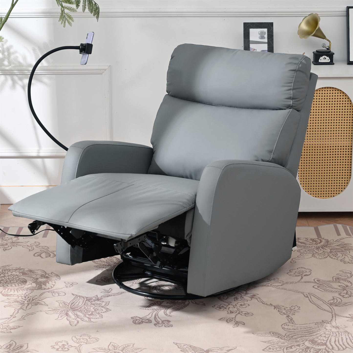 Gray leather recliner chair with swivel base and adjustable footrest