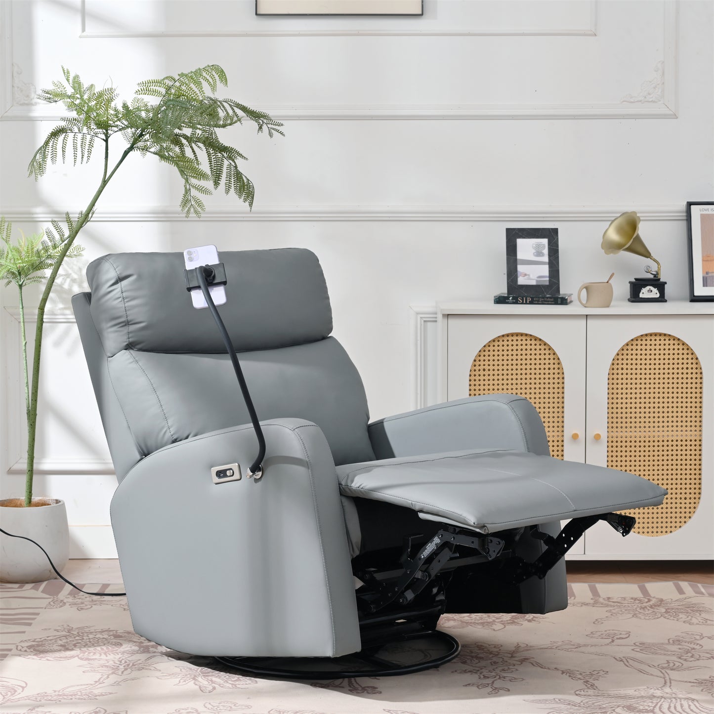 Comfortable gray leather electric recliner chair with adjustable footrest and swivel base