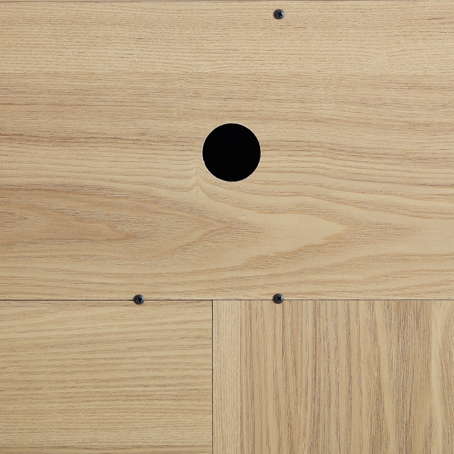 Light oak wood panel with cable management hole and screw details