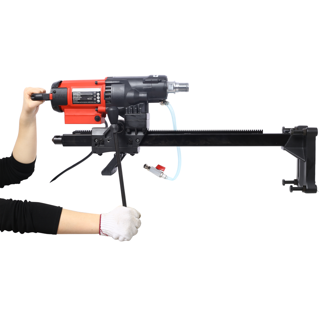 Red and black core drill with water cooling system on stand