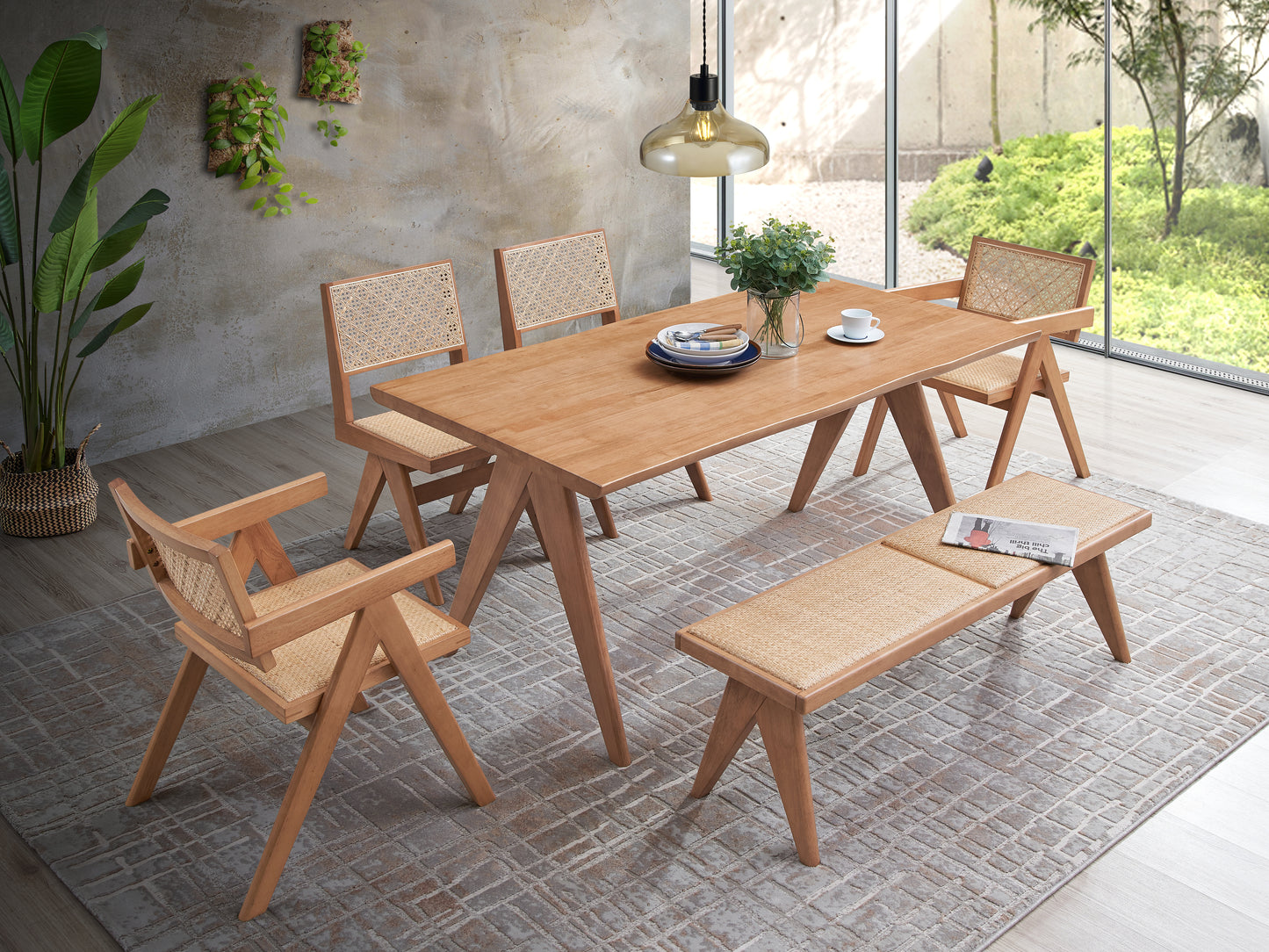 Light oak dining table with woven cane chairs and bench
