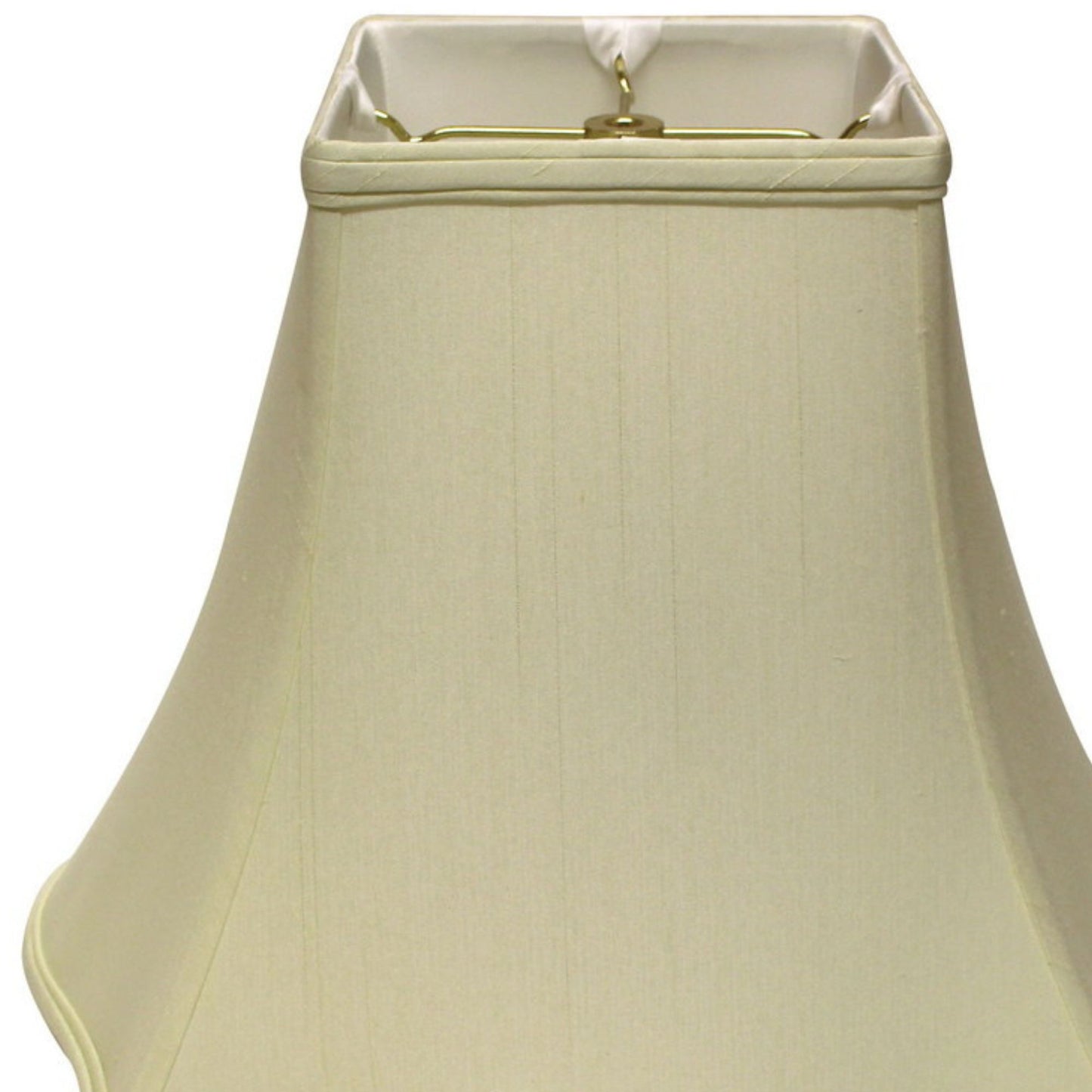 Creamcolored empire lampshade crafted from textured fabric with a brass harp fitting
