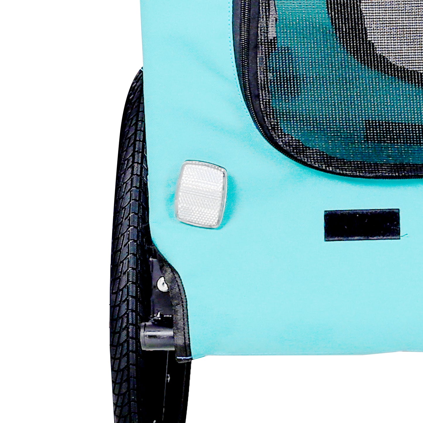 Closeup of teal pet stroller fabric with silver reflector and black wheel