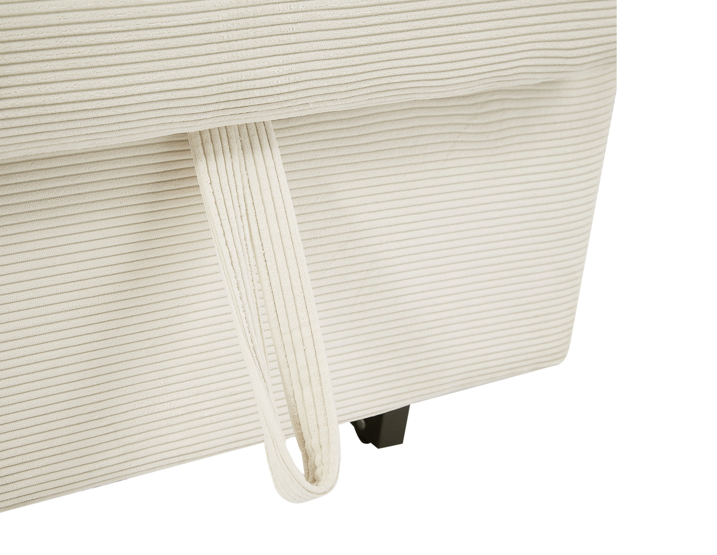 Cream corduroy sofa detail with a loop pull tab and black leg