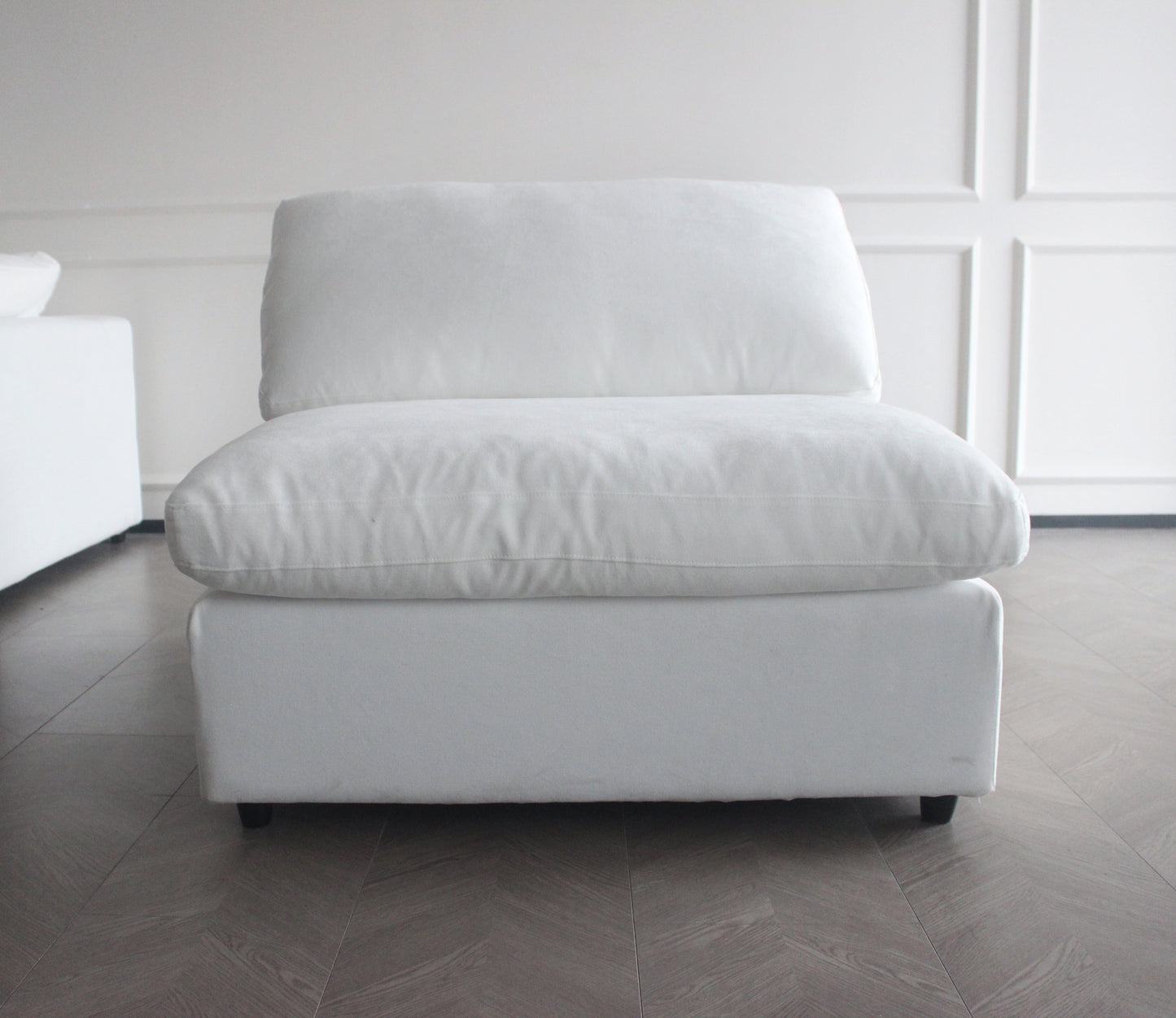 Plush white armchair with deep cushions perfect for a cozy living room
