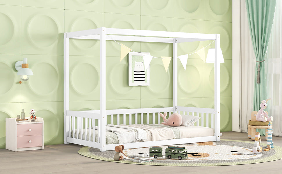 White wooden canopy bed for a childs room with whale plush toy