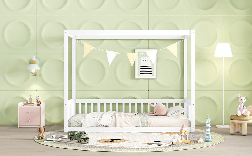 White wooden canopy bed with guardrails and bedding