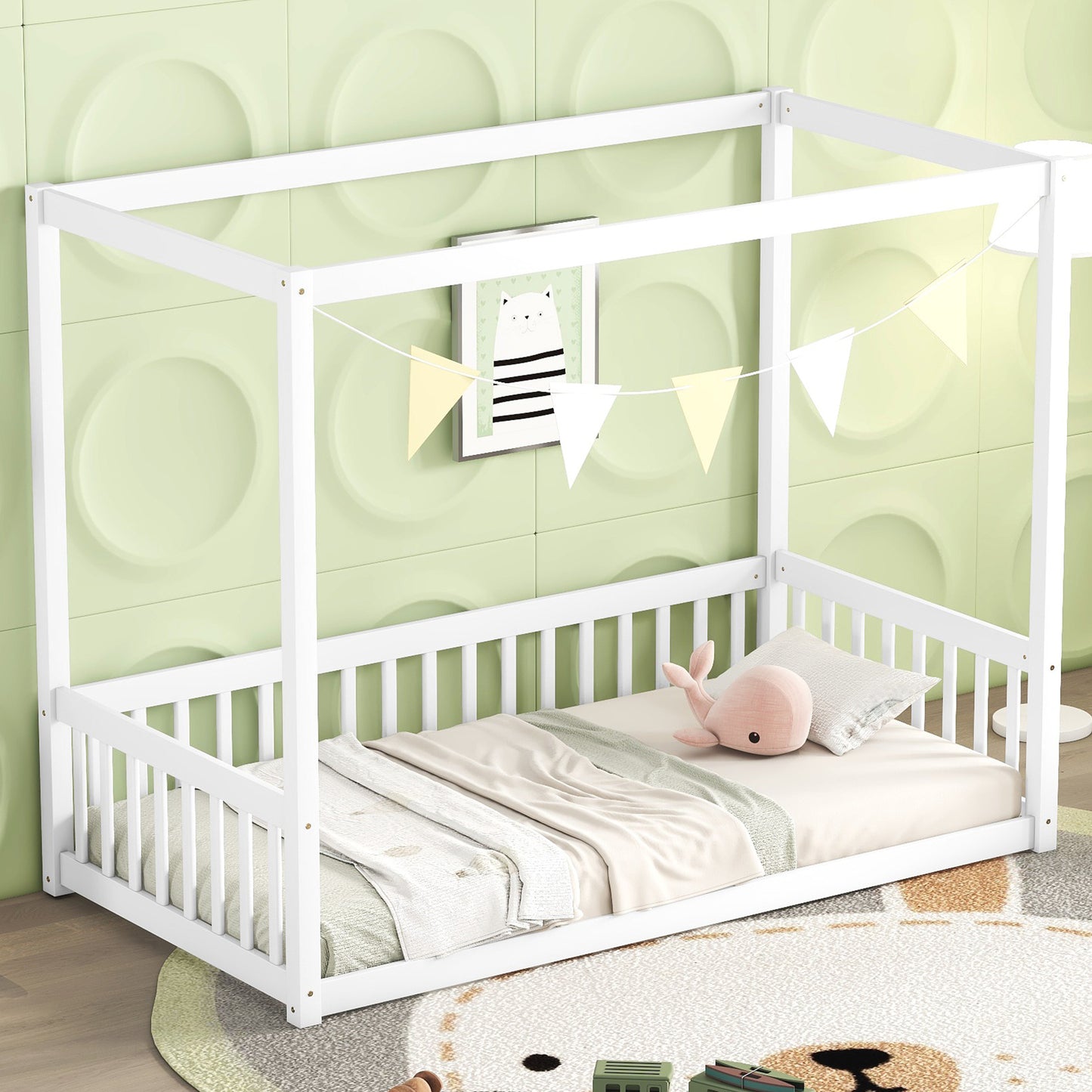White wooden canopy bed with safety rails and bedding for nursery