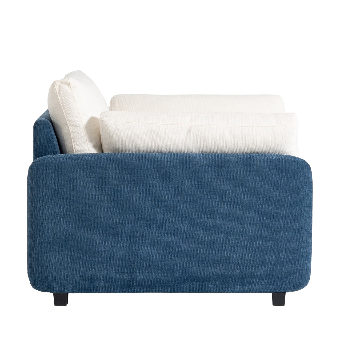 Deep blue upholstered sofa with plush white cushions modern style