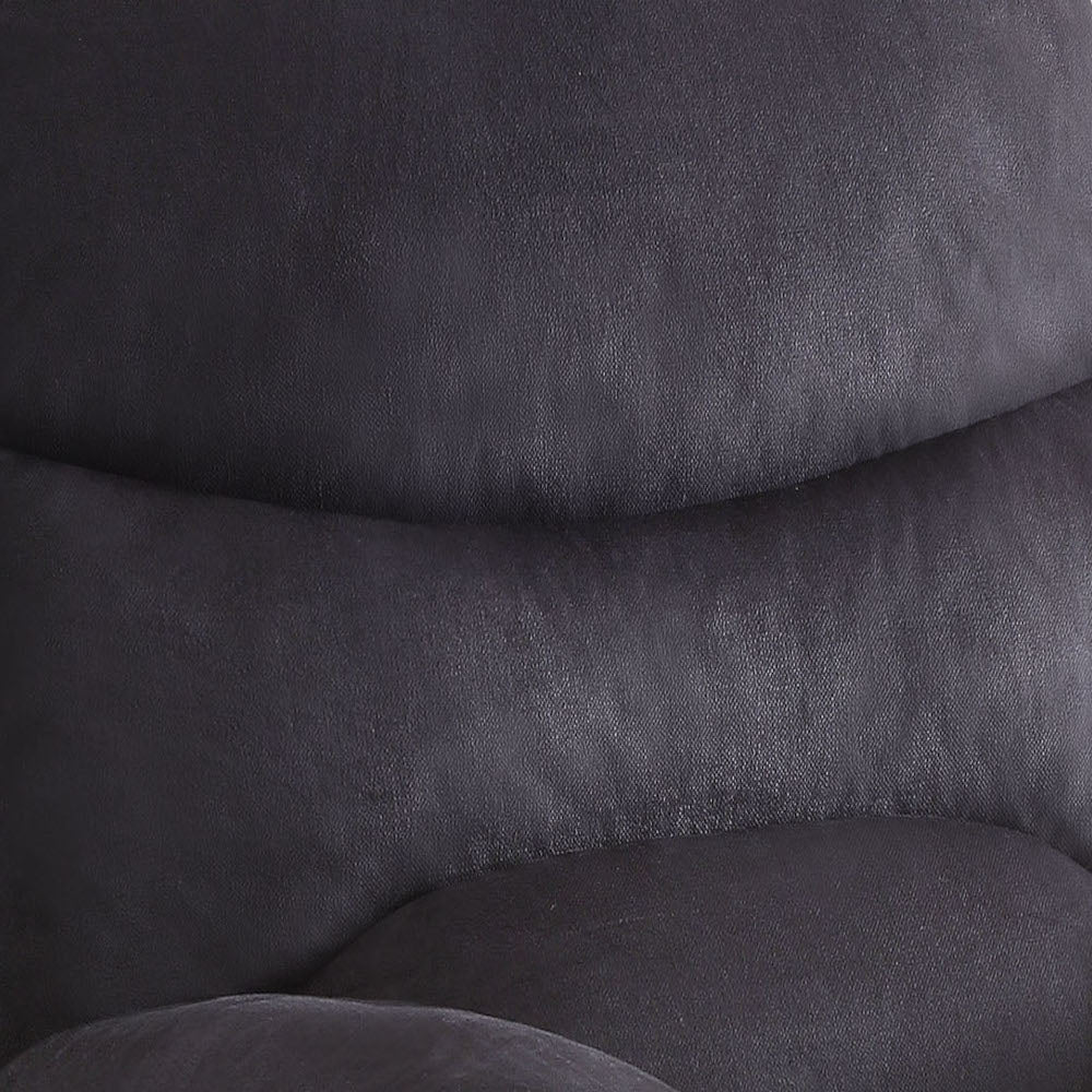 Textured dark gray fabric detail of a plush recliner chair