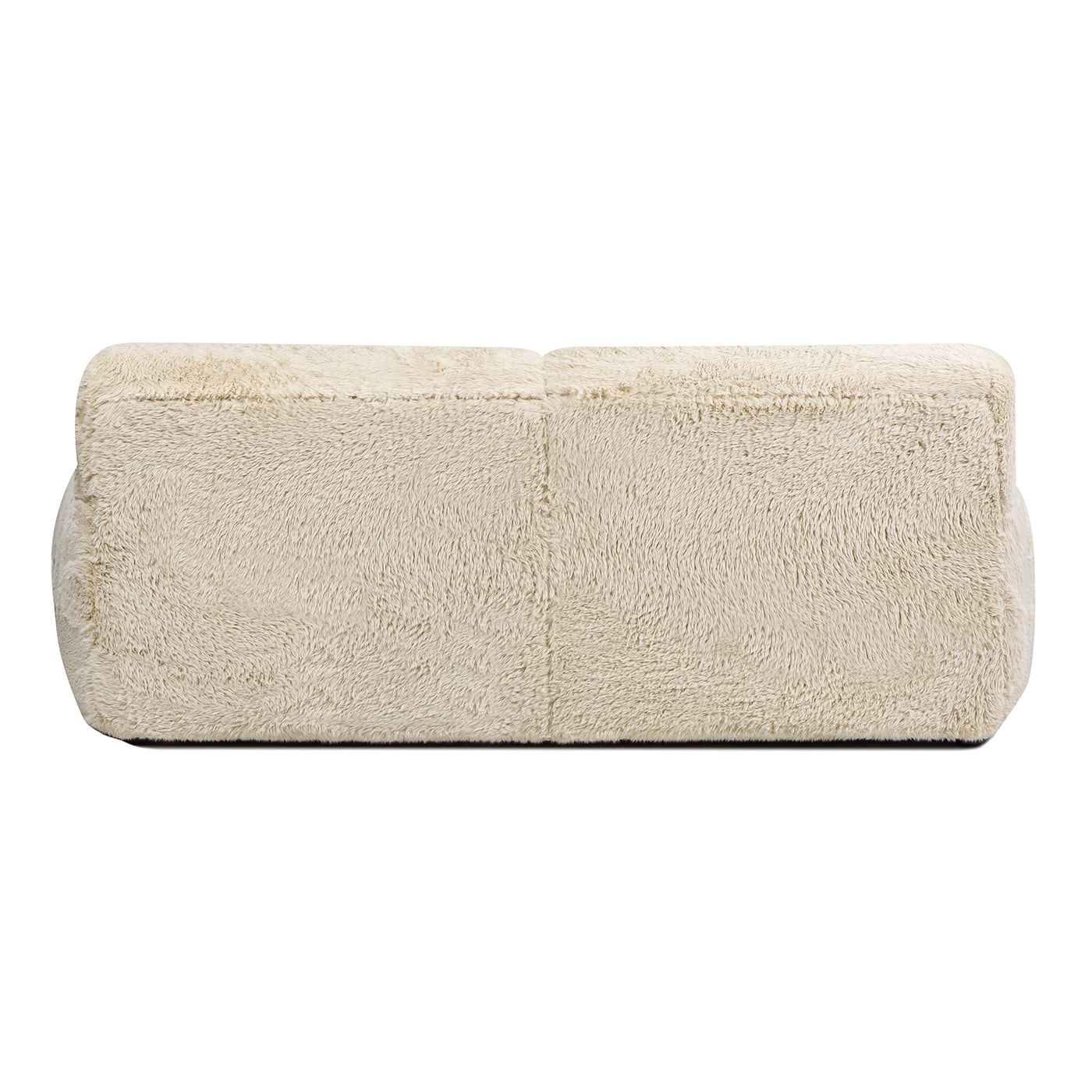 Creamy beige fuzzy bolster pillow with soft plush texture