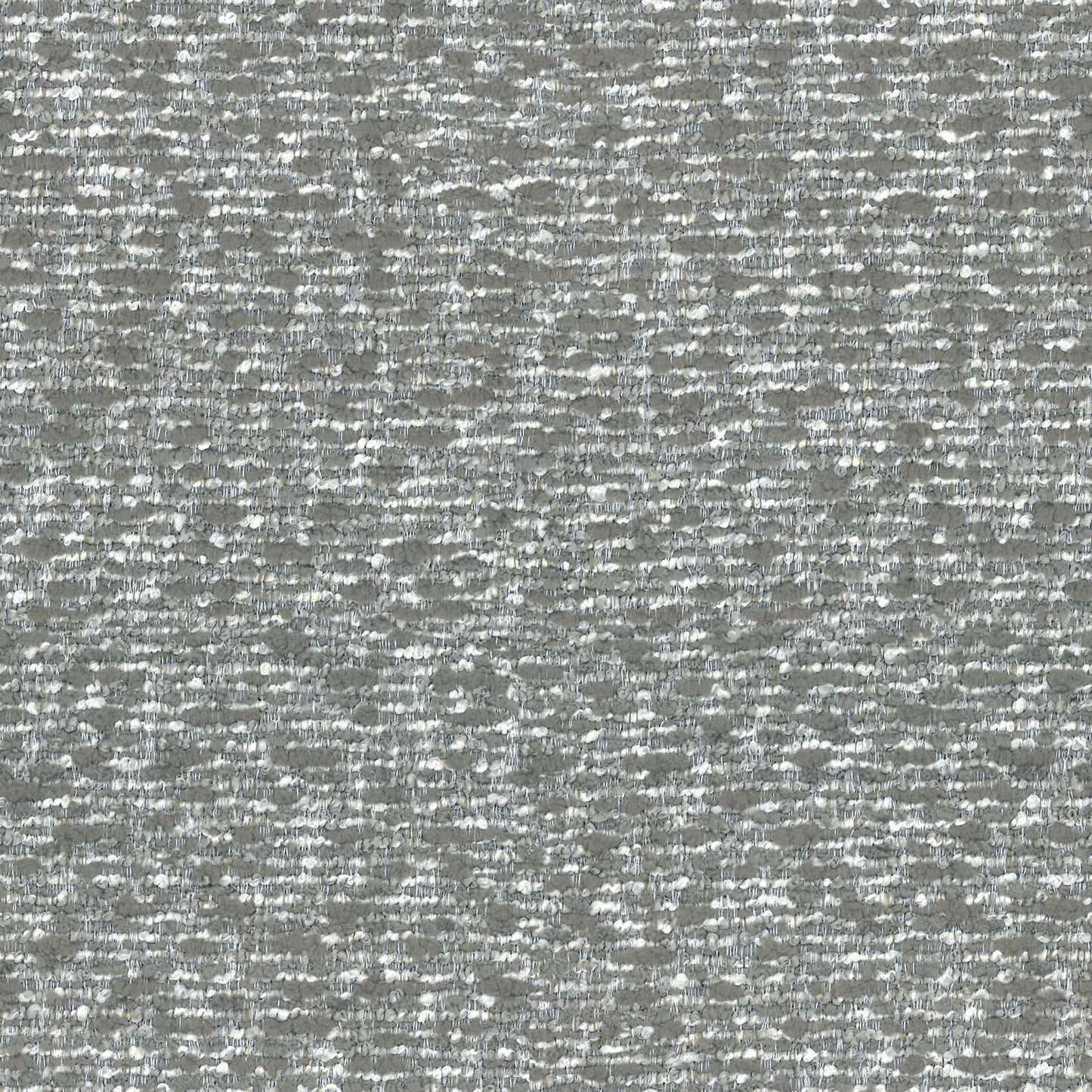 Closeup of textured grey and white boucle fabric with a subtle shimmer
