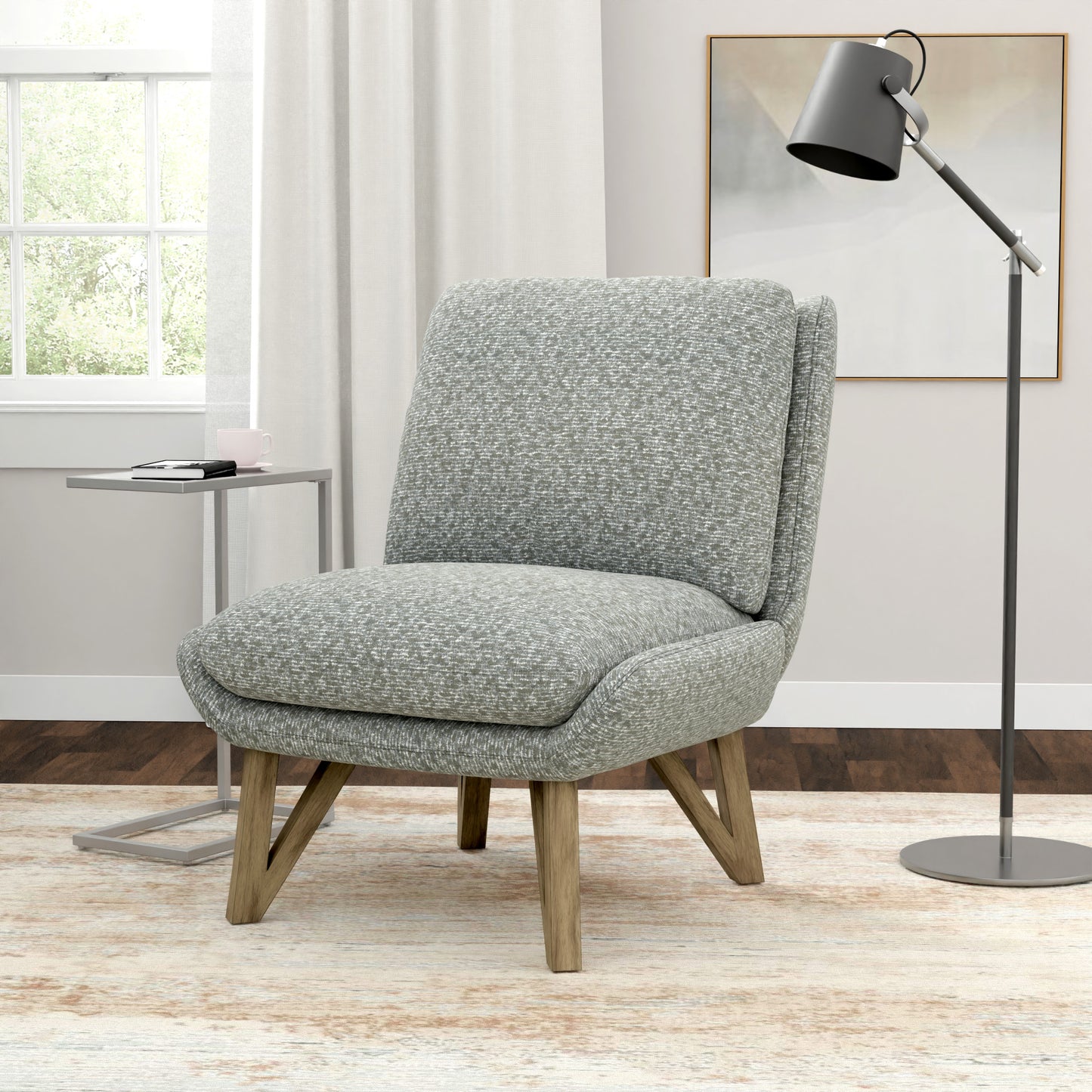 Textured grey accent chair with wooden legs and plush seating