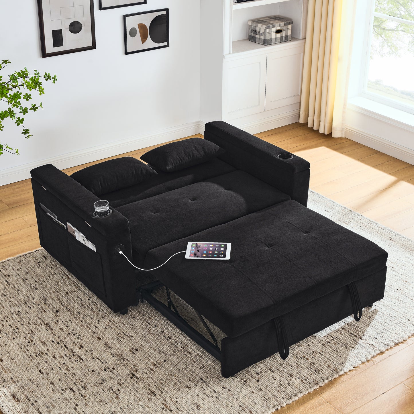 Black fabric sofa bed with builtin USB ports and cup holder