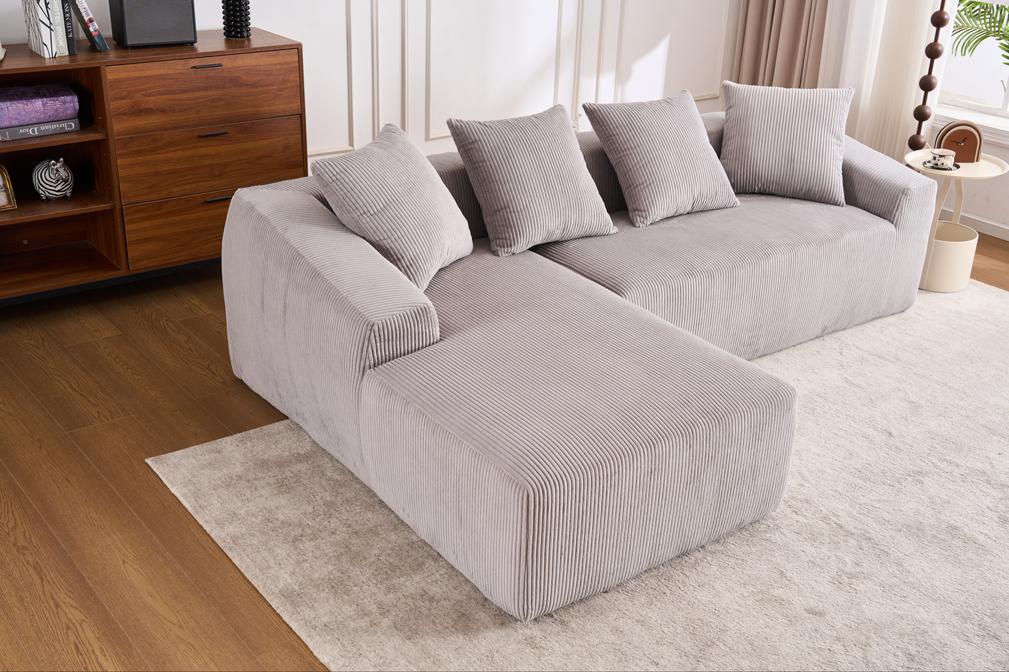 Comfortable grey corduroy sectional sofa with plush cushions perfect for living room seating