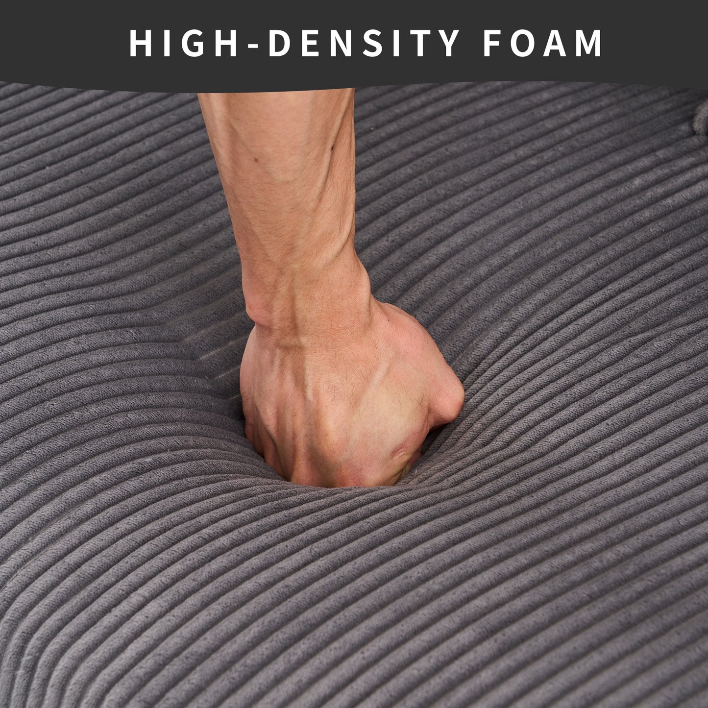 Hand pressing into gray highdensity foam cushion demonstrating plush comfort