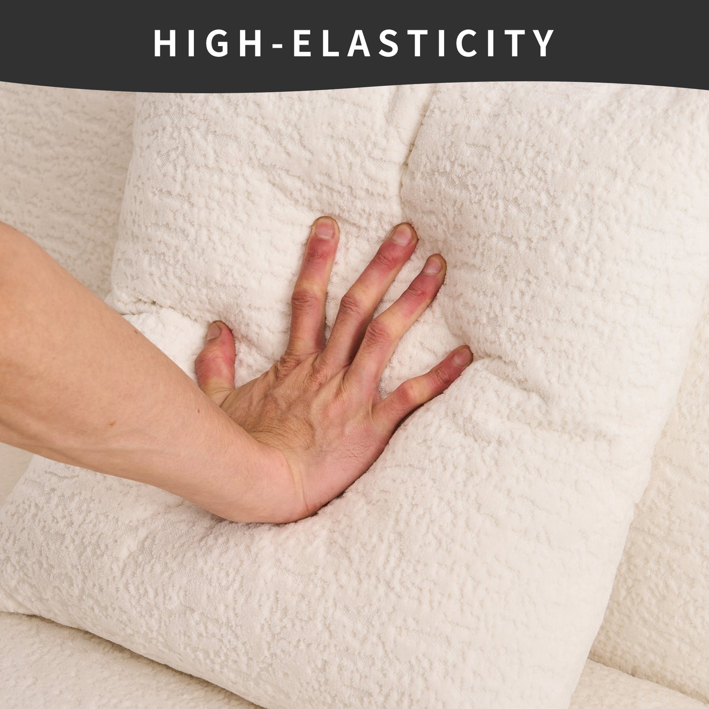 Hand pressing into plush ivory sofa cushion showcasing its high elasticity