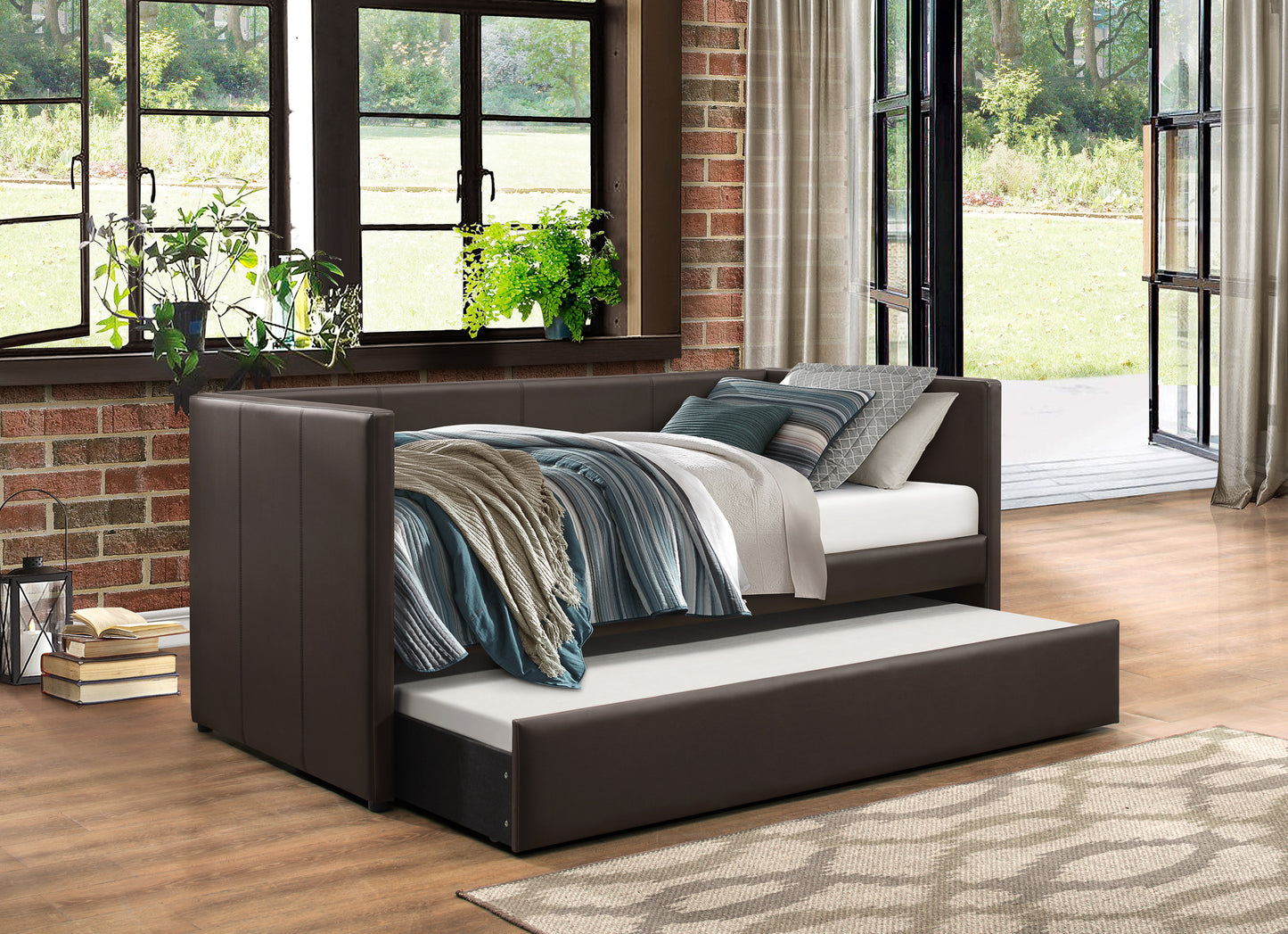 Brown leather daybed with pullout trundle perfect for guest rooms or small spaces