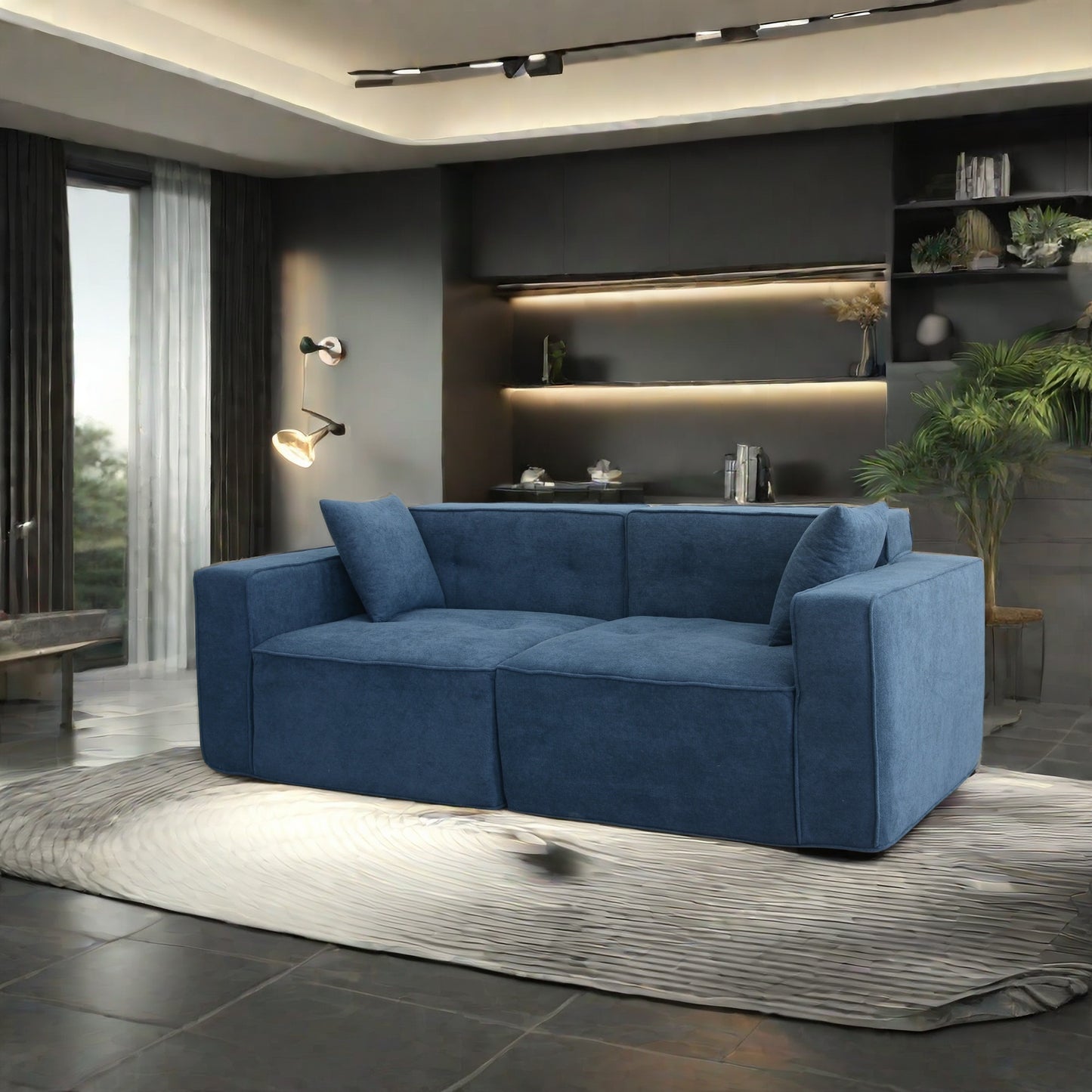 Blue fabric sectional sofa with clean lines and two throw pillows perfect for modern living rooms