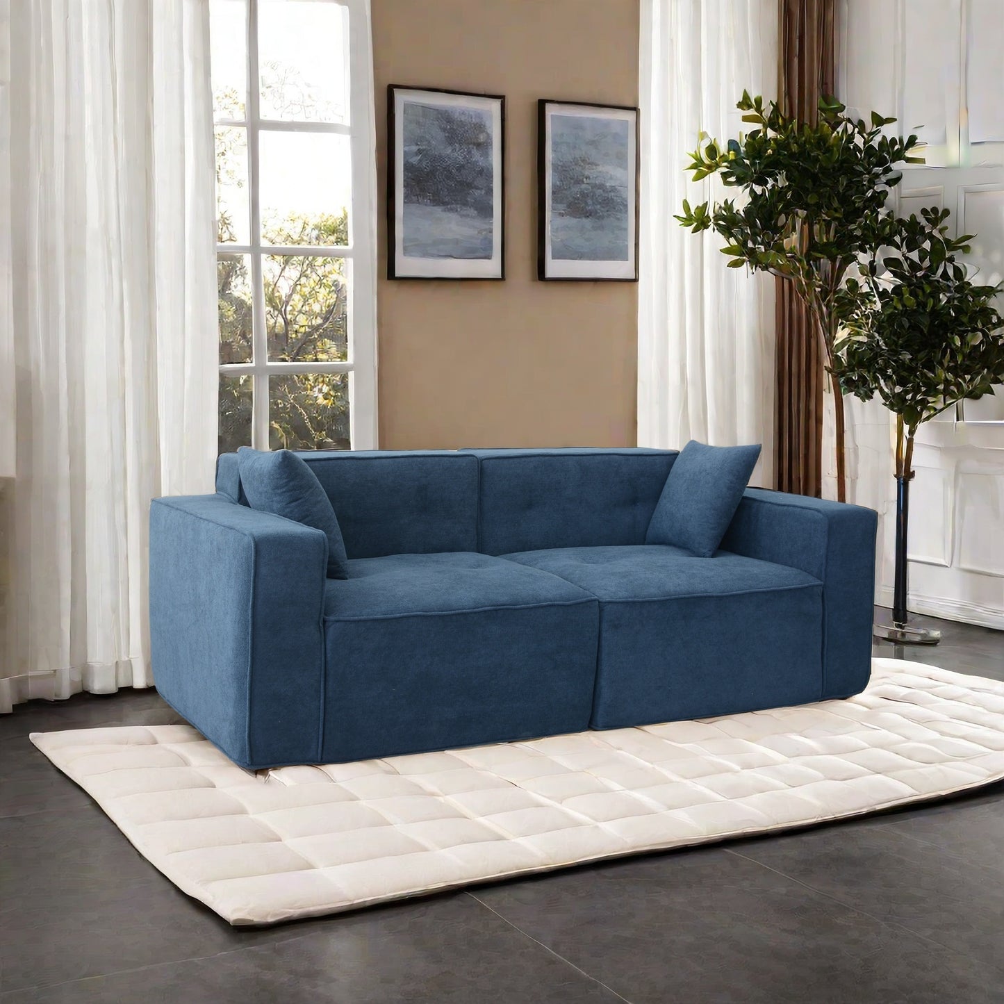 Modular navy blue fabric sofa with plush cushions and modern design