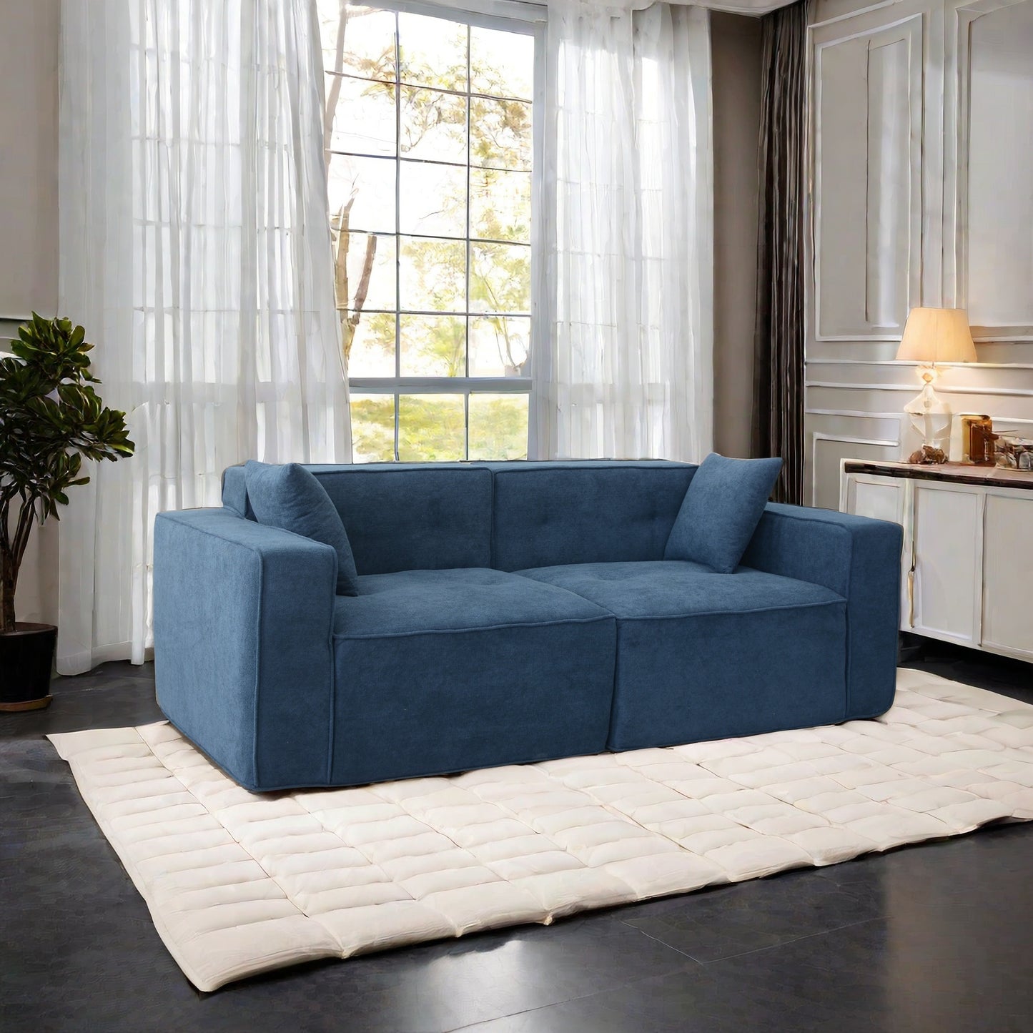 Deep blue fabric sectional sofa with tufted cushions and modern design