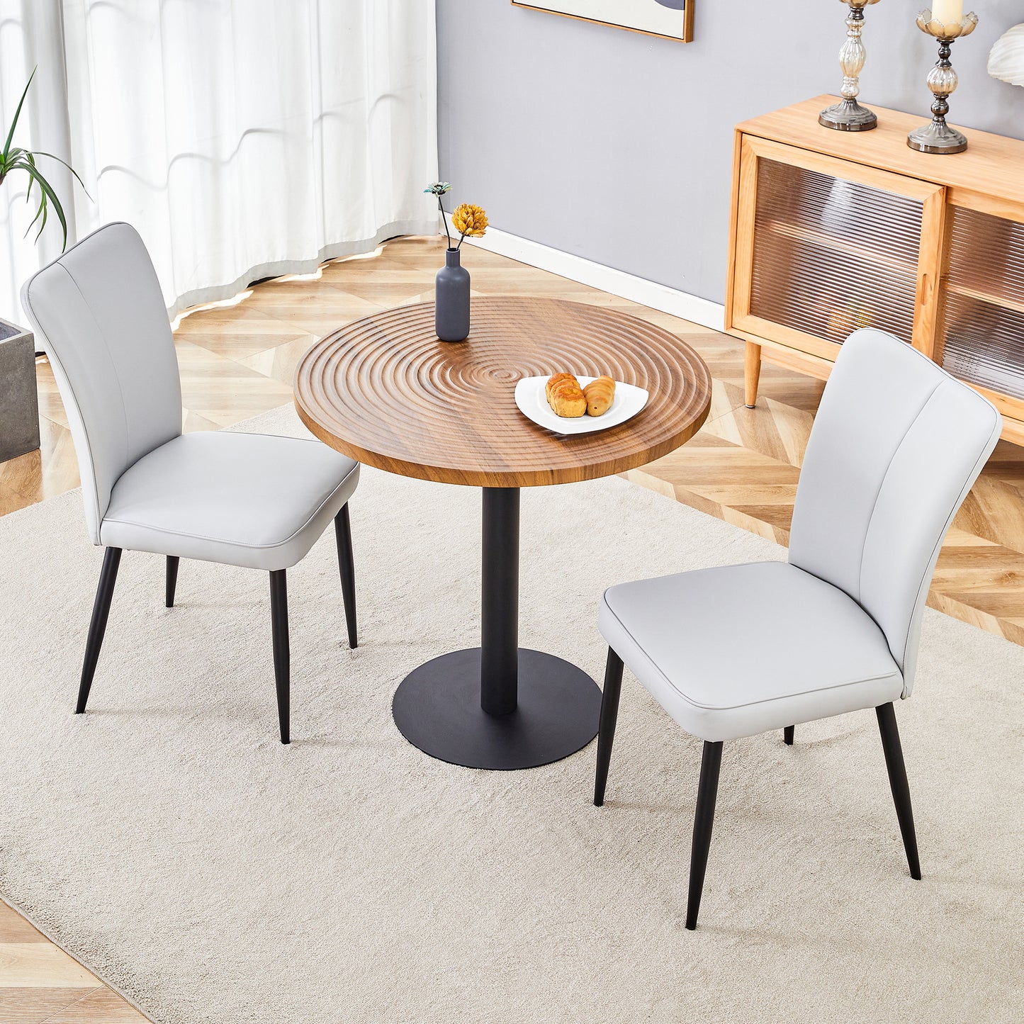 Light gray faux leather dining chair with black metal legs