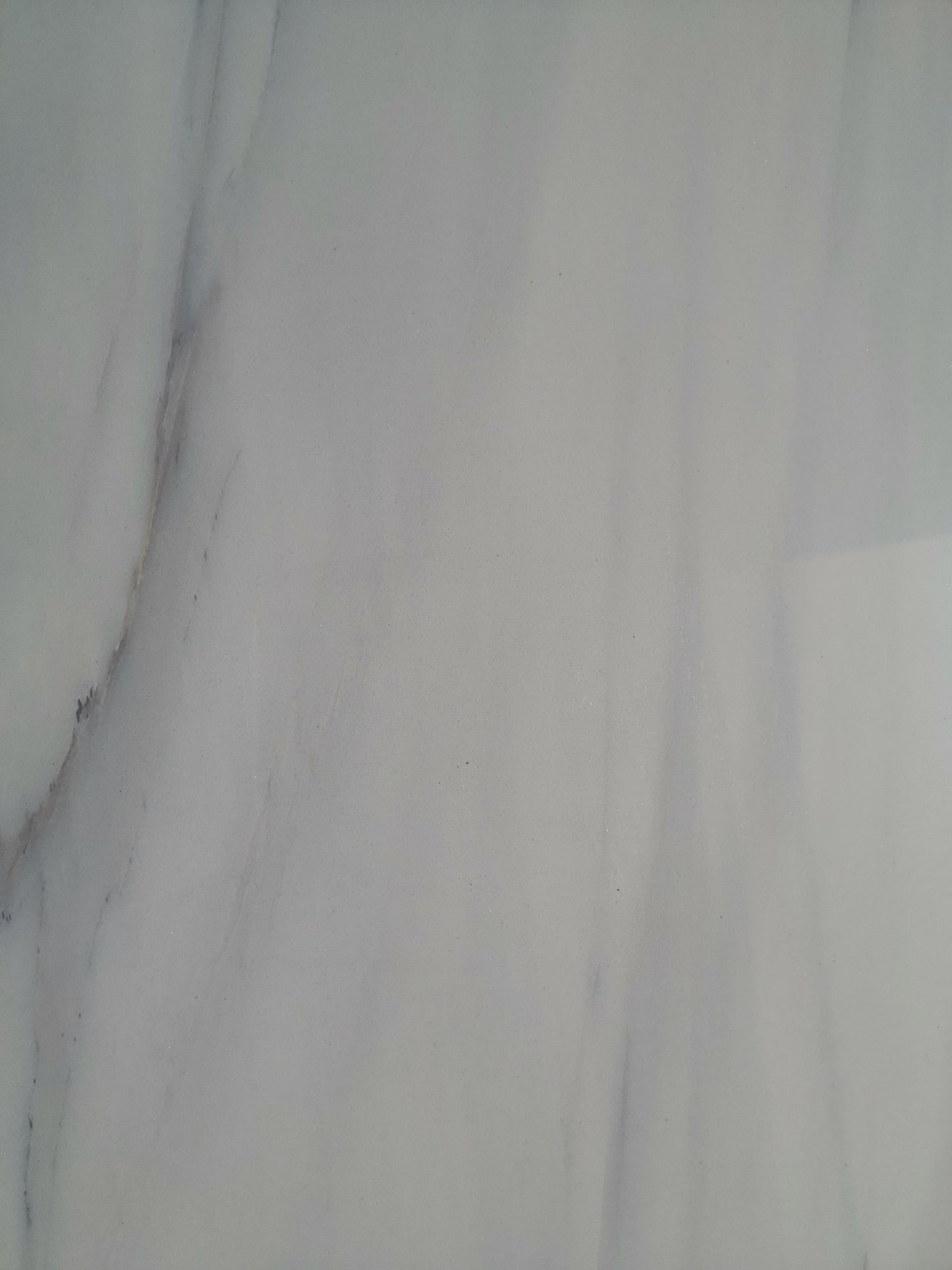 White marble tile with subtle grey veining perfect for countertops