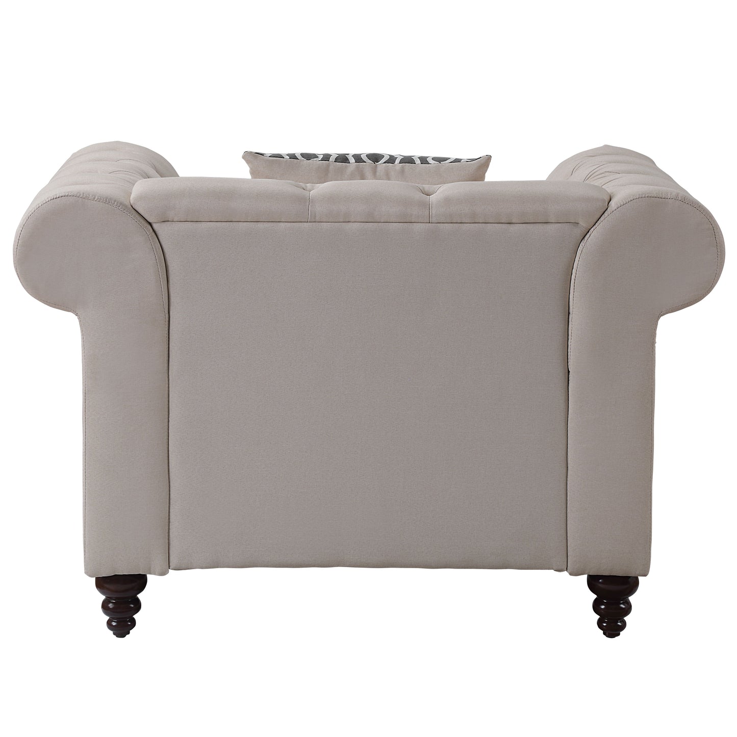 Beige upholstered chesterfield armchair with tufted back and patterned cushion