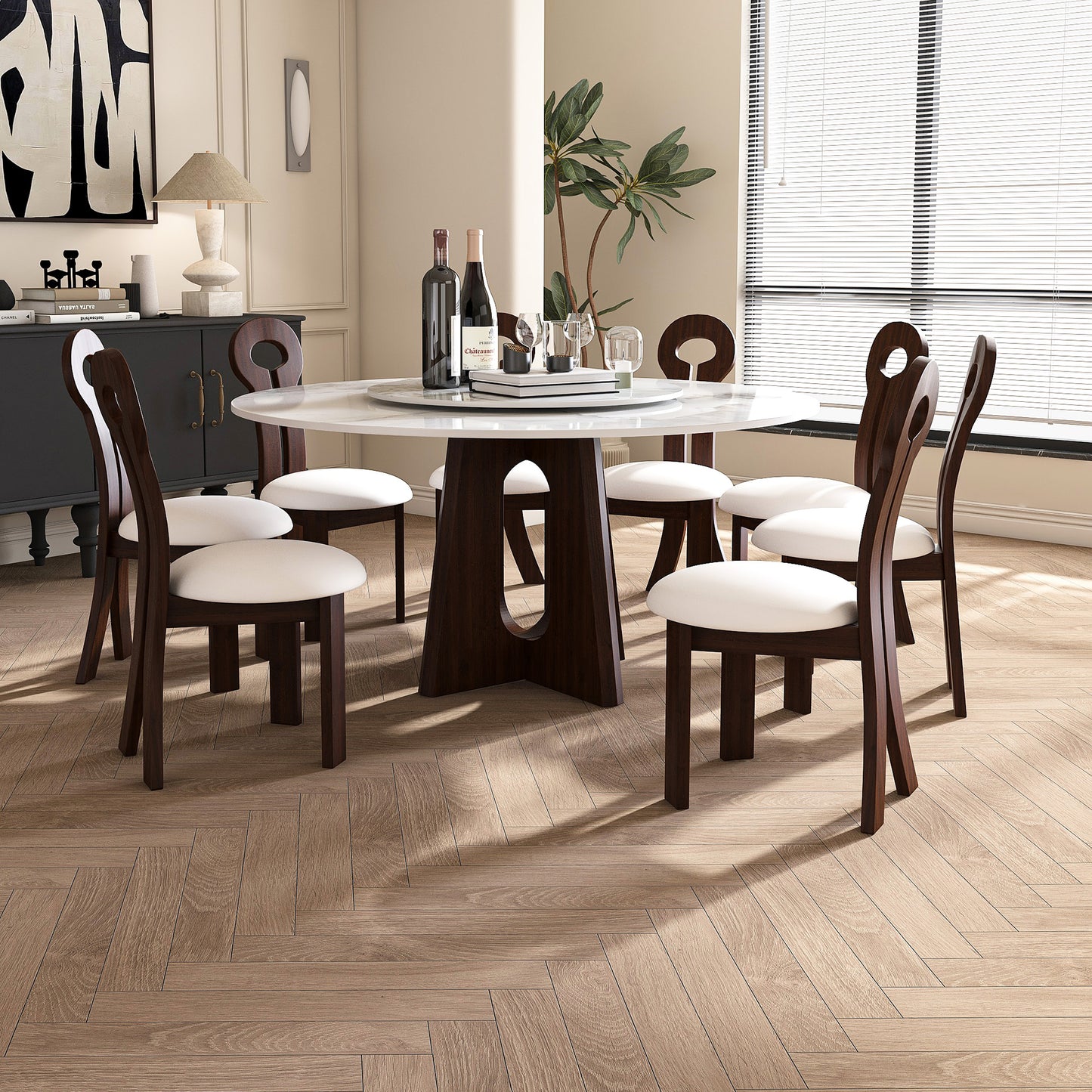 Modern white marble dining table with dark wood base and upholstered chairs